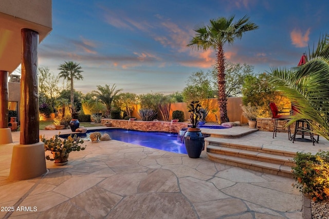 view of swimming pool with a fenced backyard, a patio, and a fenced in pool