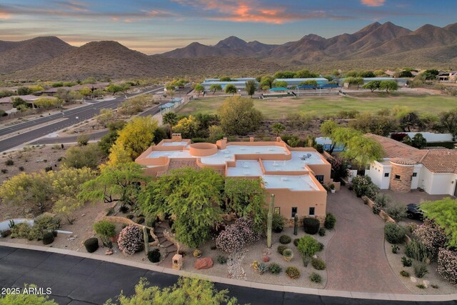 drone / aerial view featuring a mountain view