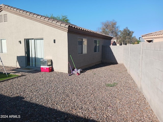 7118 S 37th Gln, Phoenix, AZ 85041 - rear view of property with a fenced backyard, a tile roof, and stucco siding