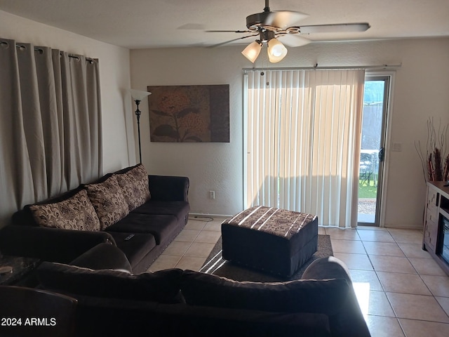 7118 S 37th Gln, Phoenix, AZ 85041 - living room featuring light tile patterned floors and a ceiling fan