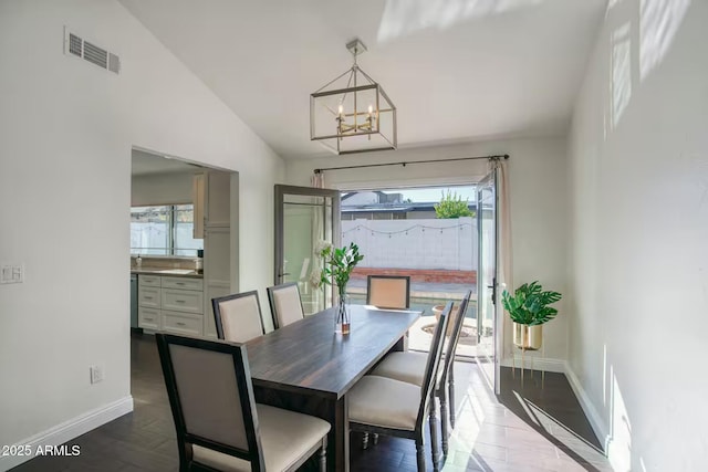5435 E Cambridge Ave, Phoenix, AZ 85008 - dining area featuring a chandelier and wood finished floors