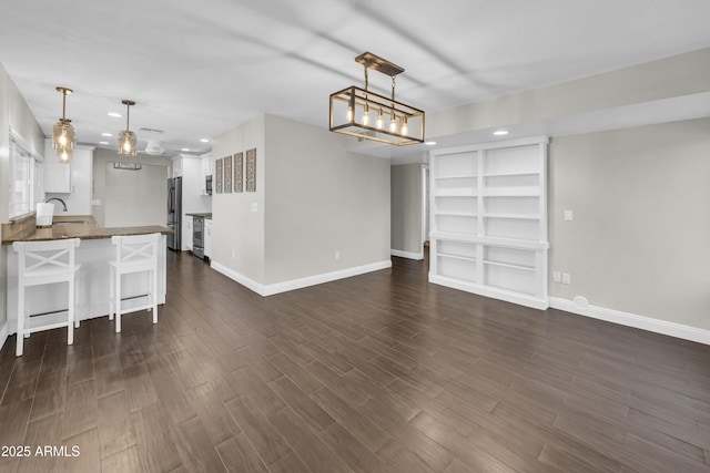 5435 E Cambridge Ave, Phoenix, AZ 85008 - unfurnished living room with recessed lighting and dark wood finished floors