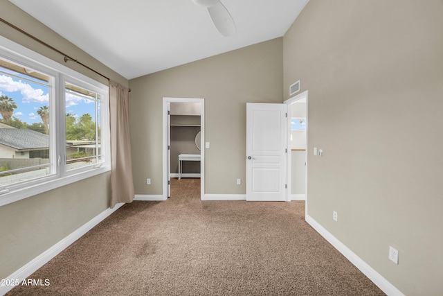5435 E Cambridge Ave, Phoenix, AZ 85008 - unfurnished bedroom with a walk in closet, carpet, a closet, a ceiling fan, and high vaulted ceiling