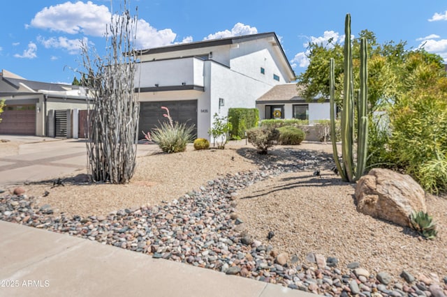 5435 E Cambridge Ave, Phoenix, AZ 85008 - view of front facade featuring driveway, stucco siding, and an attached garage