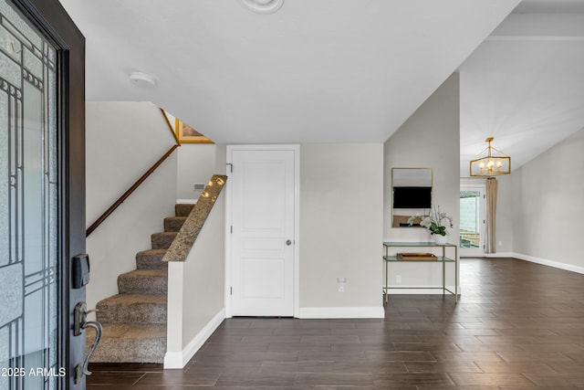 5435 E Cambridge Ave, Phoenix, AZ 85008 - entryway featuring dark wood finished floors, stairs, and a chandelier