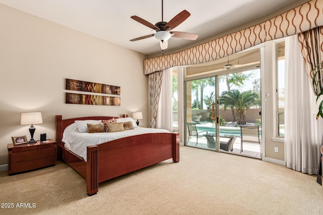 bedroom with access to exterior, ceiling fan, and carpet flooring