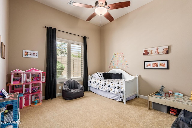 bedroom with ceiling fan and light carpet