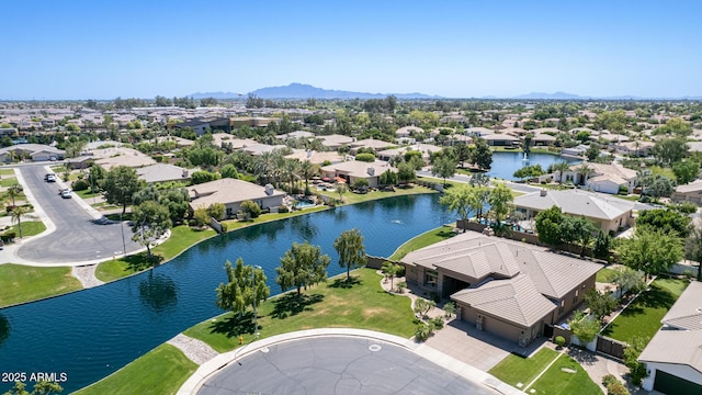 bird's eye view with a water and mountain view