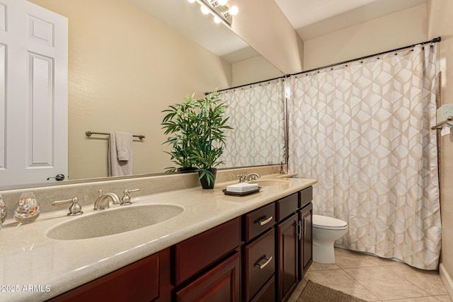 bathroom with vanity, toilet, and tile patterned flooring