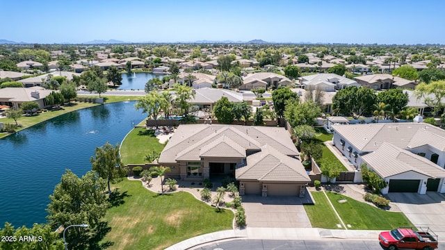 birds eye view of property with a water view