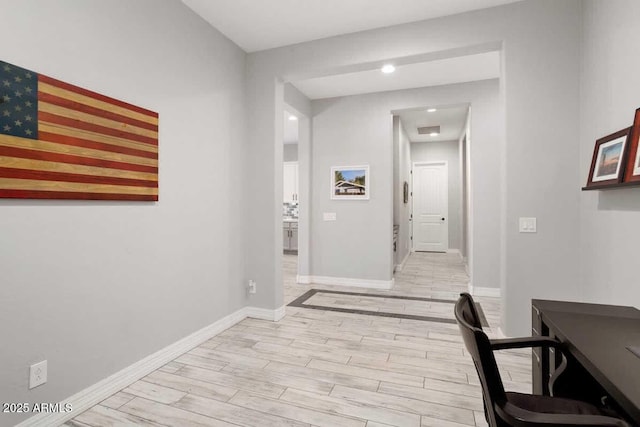 office with visible vents, light wood-style flooring, and baseboards