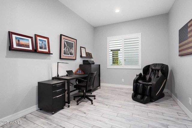 office area with light wood finished floors, baseboards, and recessed lighting