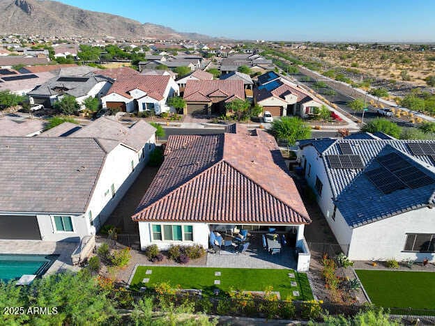 birds eye view of property with a mountain view