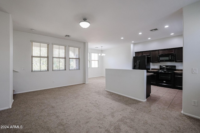 kitchen with light carpet, decorative light fixtures, an inviting chandelier, and black appliances