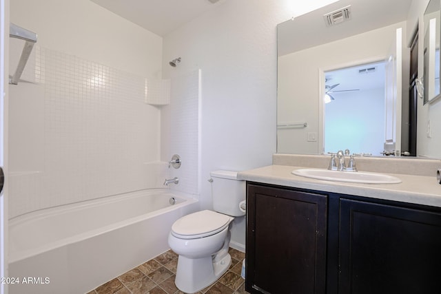 full bathroom featuring vanity, toilet, and tiled shower / bath