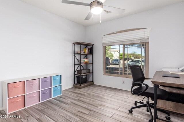 office featuring visible vents, wood finished floors, baseboards, and ceiling fan