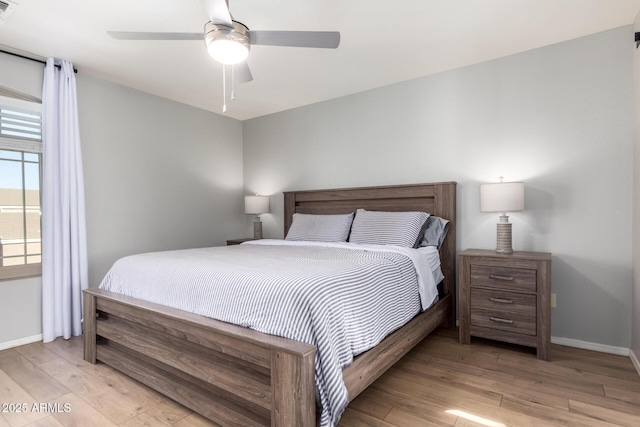bedroom with visible vents, baseboards, and light wood-type flooring