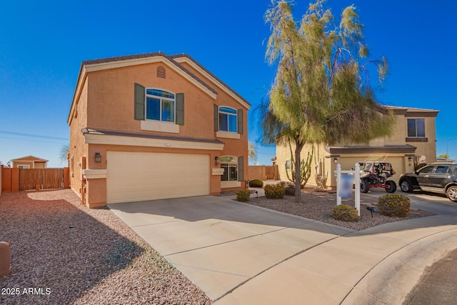 traditional-style home with stucco siding, driveway, a garage, and fence