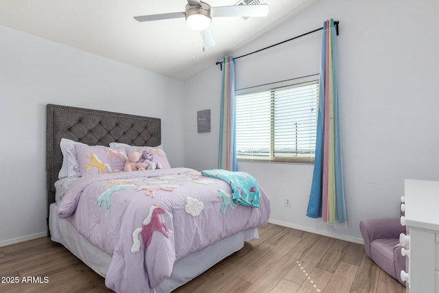 bedroom featuring a ceiling fan, wood finished floors, and baseboards