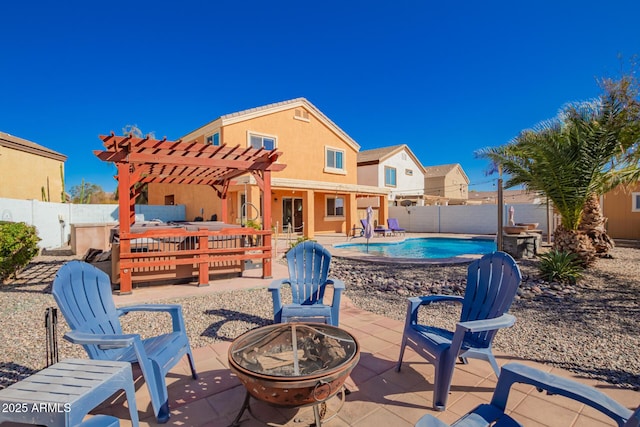 view of patio / terrace featuring a fenced in pool, an outdoor fire pit, a fenced backyard, and a pergola