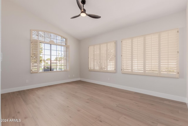 unfurnished room featuring ceiling fan, light hardwood / wood-style flooring, and lofted ceiling