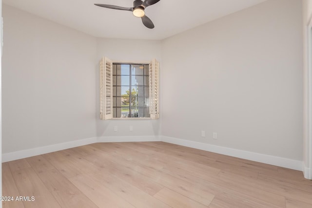 spare room featuring ceiling fan and light hardwood / wood-style floors