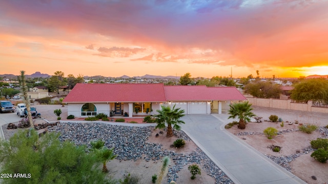 view of front of house with a mountain view and a garage