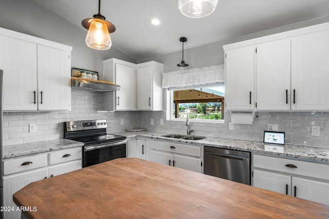 kitchen featuring stainless steel appliances, white cabinetry, hanging light fixtures, and sink