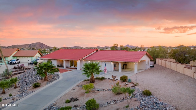 view of front facade featuring a mountain view and a garage