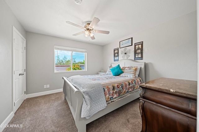 bedroom featuring ceiling fan and light colored carpet