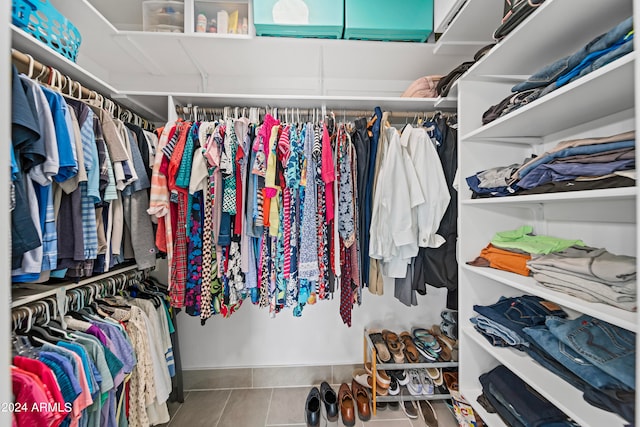 spacious closet featuring tile patterned floors