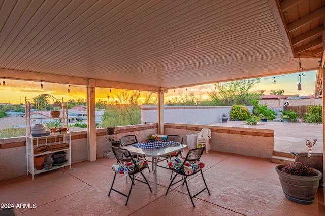 view of patio terrace at dusk