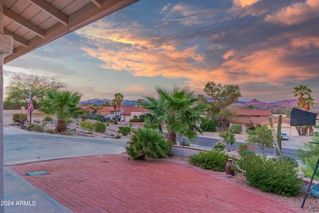 patio terrace at dusk with a mountain view