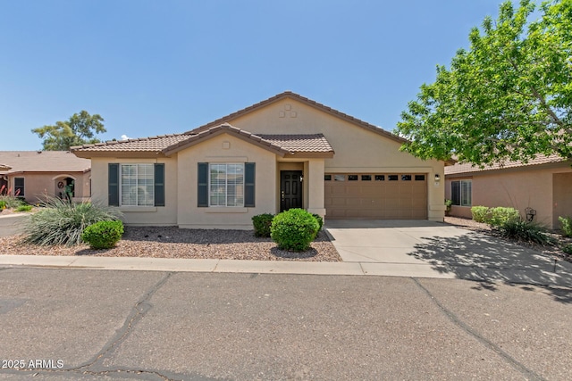 1713 N Sinova, Mesa, AZ 85205 - ranch-style home featuring a garage, driveway, stucco siding, and a tiled roof