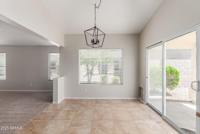 1713 N Sinova, Mesa, AZ 85205 - unfurnished dining area with an inviting chandelier and baseboards