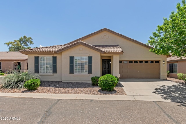 1713 N Sinova, Mesa, AZ 85205 - view of front facade featuring a garage, driveway, stucco siding, and a tile roof