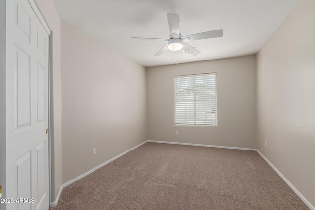 1713 N Sinova, Mesa, AZ 85205 - spare room featuring baseboards, a ceiling fan, and carpet