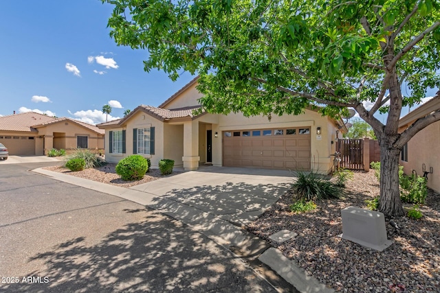 1713 N Sinova, Mesa, AZ 85205 - view of front of property featuring a tiled roof, a garage, fence, stucco siding, and driveway