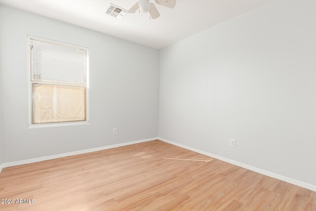 spare room with ceiling fan and light hardwood / wood-style floors