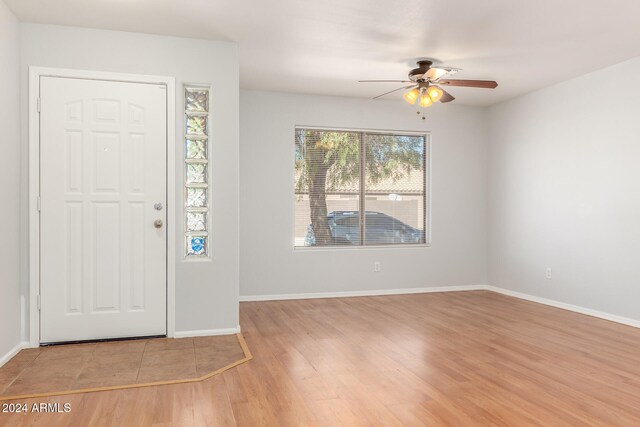 entryway with ceiling fan and light hardwood / wood-style flooring