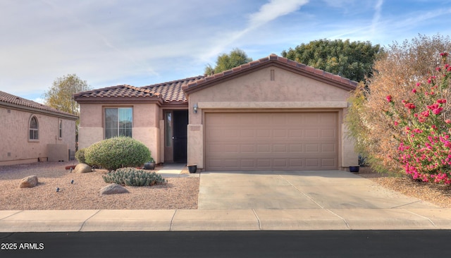 mediterranean / spanish-style home featuring a garage