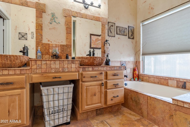 1437 E Glenhaven Dr, Phoenix, AZ 85048 - full bath featuring stone tile floors, a bath, and vanity