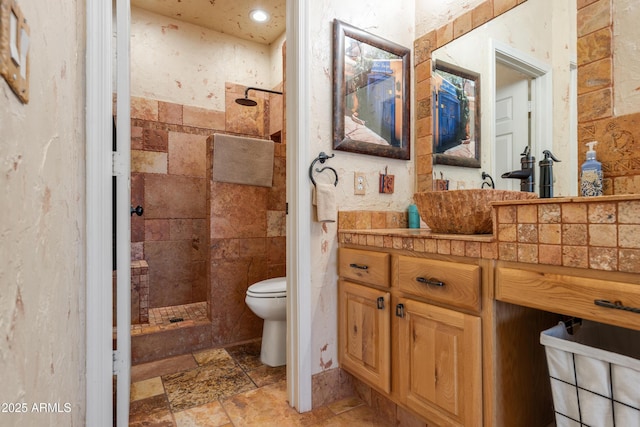 1437 E Glenhaven Dr, Phoenix, AZ 85048 - bathroom with a walk in shower, toilet, stone tile floors, vanity, and recessed lighting