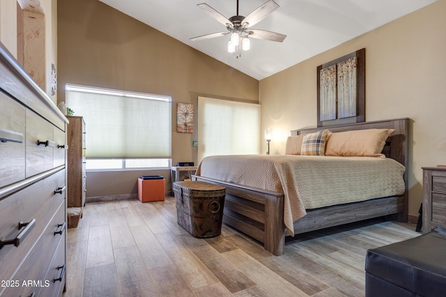 1437 E Glenhaven Dr, Phoenix, AZ 85048 - bedroom with wood finished floors, lofted ceiling, and ceiling fan