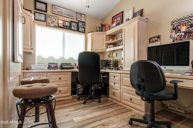 1437 E Glenhaven Dr, Phoenix, AZ 85048 - office area featuring built in study area, light wood finished floors, and vaulted ceiling