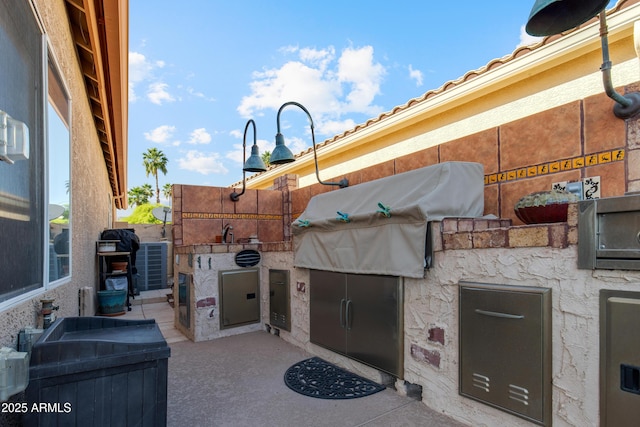 1437 E Glenhaven Dr, Phoenix, AZ 85048 - view of patio with exterior kitchen and grilling area