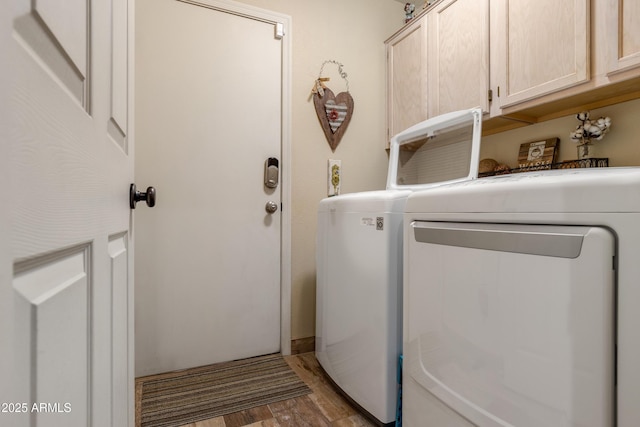 1437 E Glenhaven Dr, Phoenix, AZ 85048 - clothes washing area featuring cabinet space, washer and dryer, and wood finished floors