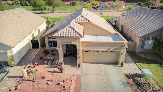 1437 E Glenhaven Dr, Phoenix, AZ 85048 - view of front of house with stucco siding, a tile roof, driveway, a residential view, and an attached garage