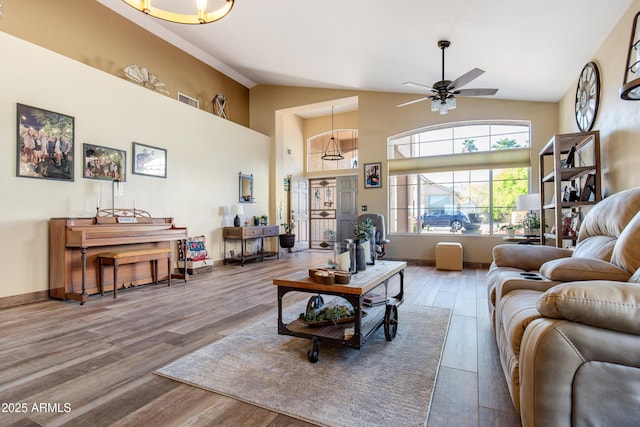 1437 E Glenhaven Dr, Phoenix, AZ 85048 - living area featuring a ceiling fan, wood finished floors, and high vaulted ceiling