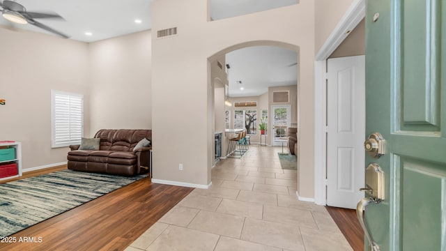 116 E Mountain Sky Ave, Phoenix, AZ 85048 - tiled foyer entrance with arched walkways, ceiling fan, a towering ceiling, and recessed lighting
